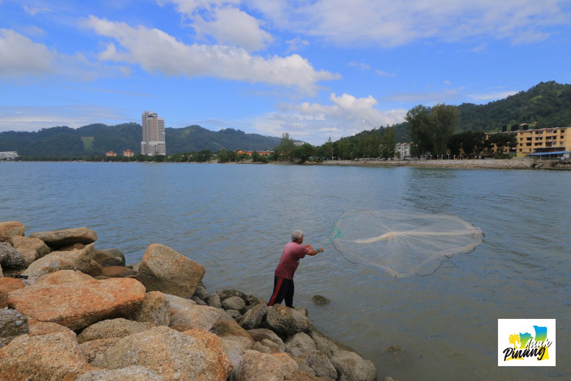 Fisherman at the mouth of Sungai Batu, near Teluk Kumbar